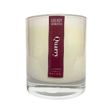 Load image into Gallery viewer, Candle with a purple label on a white background
